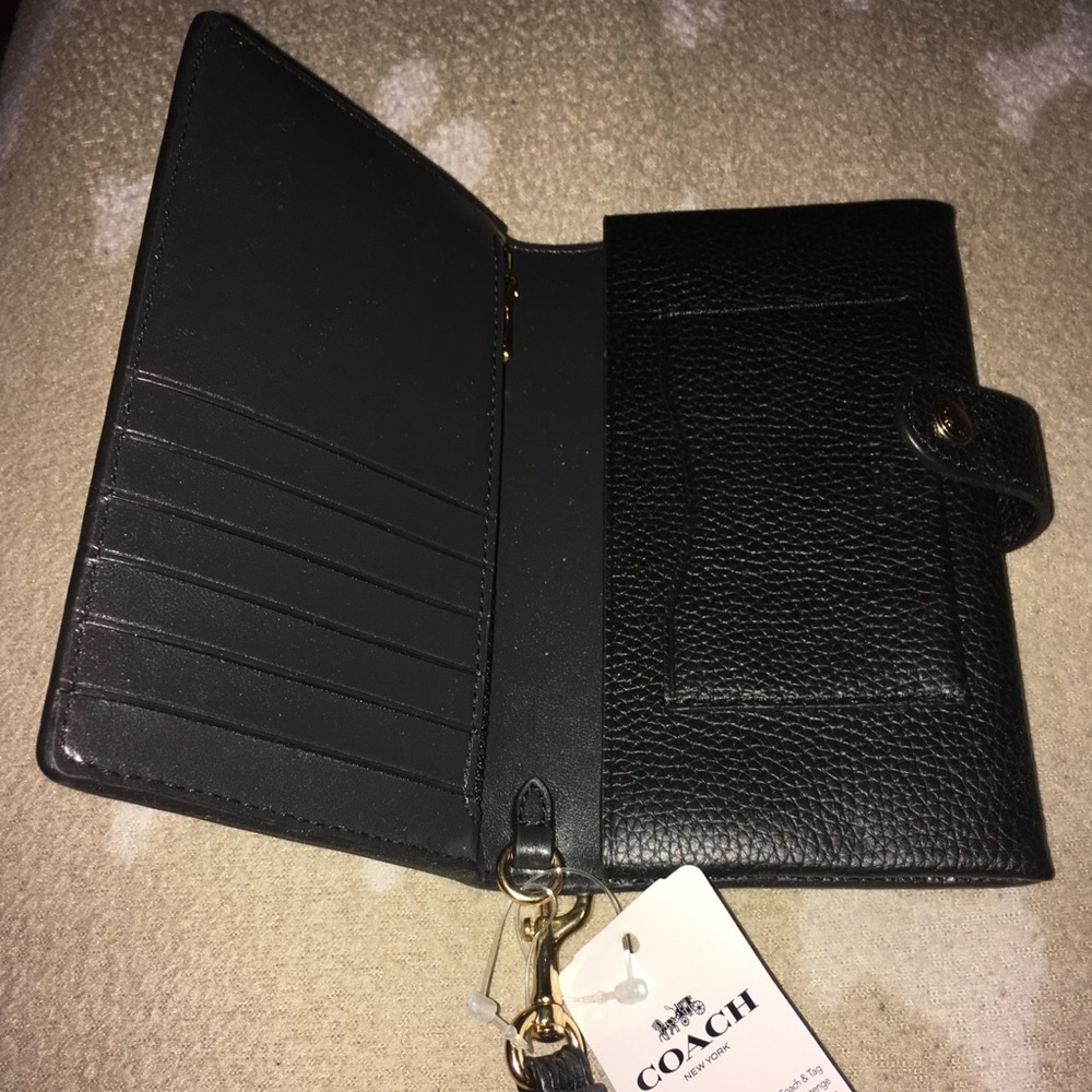 NWT Coach wristlet in black leather.